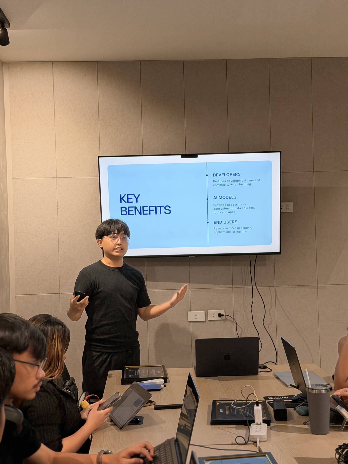 An intern presenting key benefits of AI tooling to the team